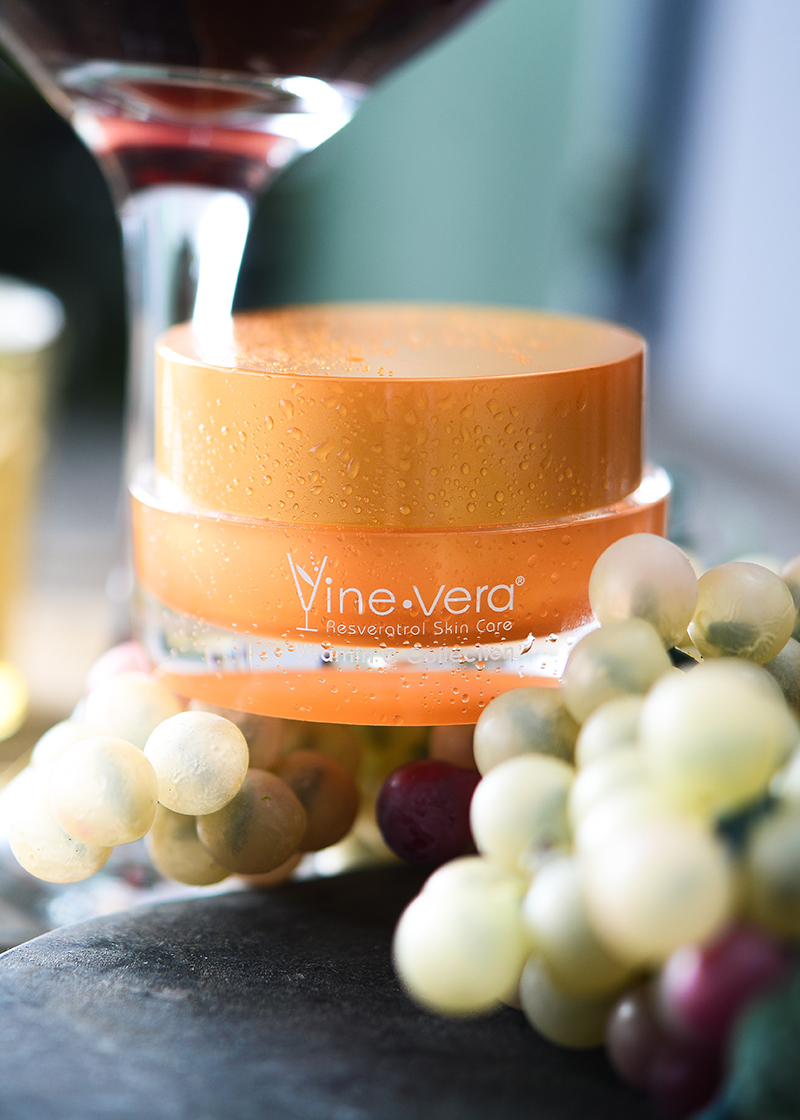 Resveratrol Vitamin C Lip Balm with a wine background